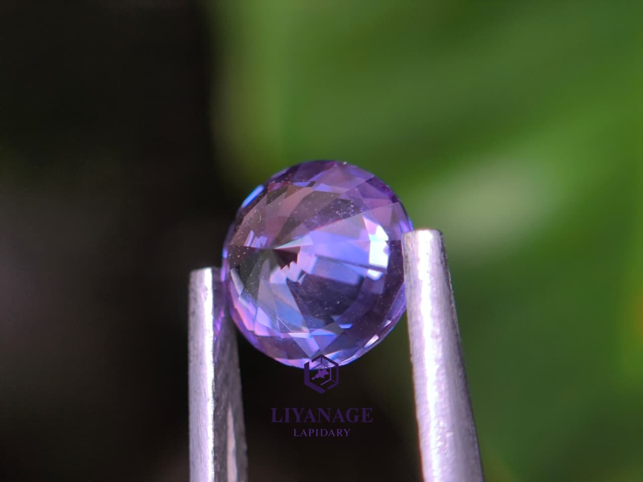 1.25 ct unheated Ceylon purple sapphire round cut with pink violet and bluish hue