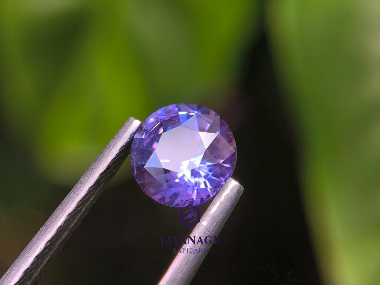 1.25 ct unheated Ceylon purple sapphire round cut with pink violet and bluish hue
