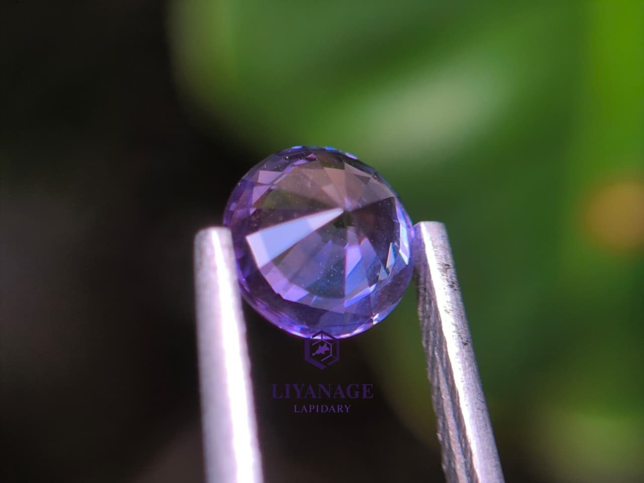 1.25 ct unheated Ceylon purple sapphire round cut with pink violet and bluish hue