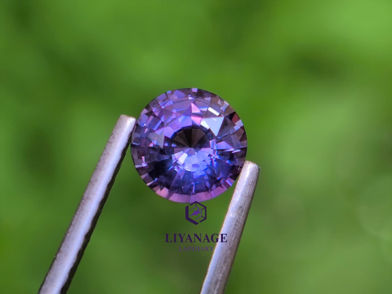 1.25 ct unheated Ceylon purple sapphire round cut with pink violet and bluish hue