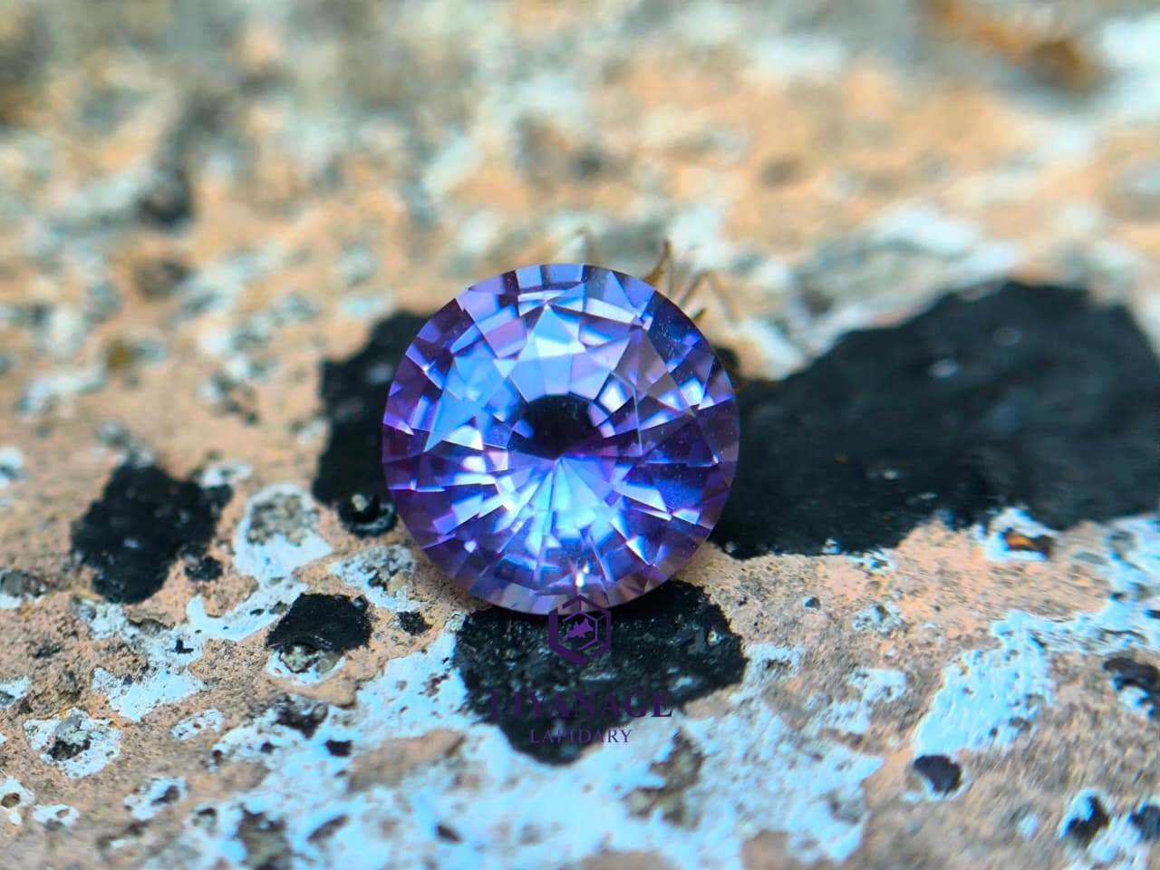 Close-up of Ceylon purple sapphire showing pink violet purple and bluish hue